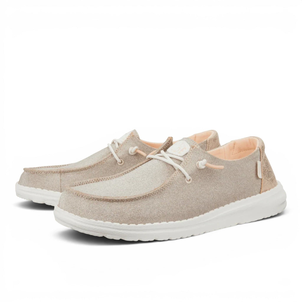 ShoeShop Hey Dude Wendy metallic sparkle slip-on shoes in beige with elastic laces and white flexible sole