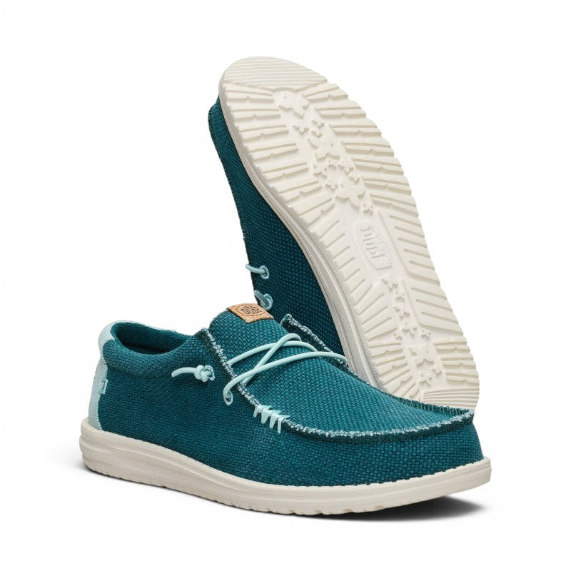 ShoeShop Hey Dude teal canvas slip-on shoes with white textured soles and decorative laces