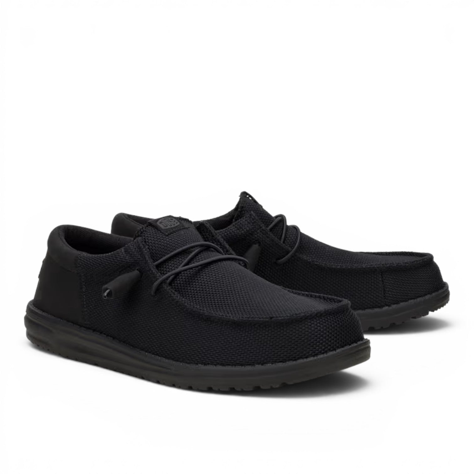 ShoeShop Hey Dude Wally Funk Mono slip-on shoes in all-black with a textured fabric upper and elastic laces.