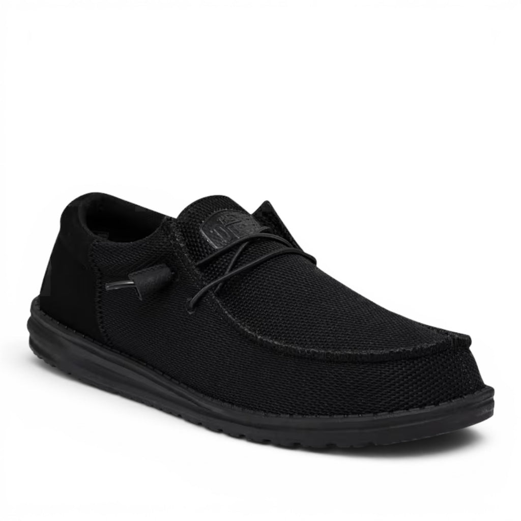 ShoeShop Hey Dude Wally Funk Mono slip-on shoe in black with a textured mesh upper and lightweight sole.