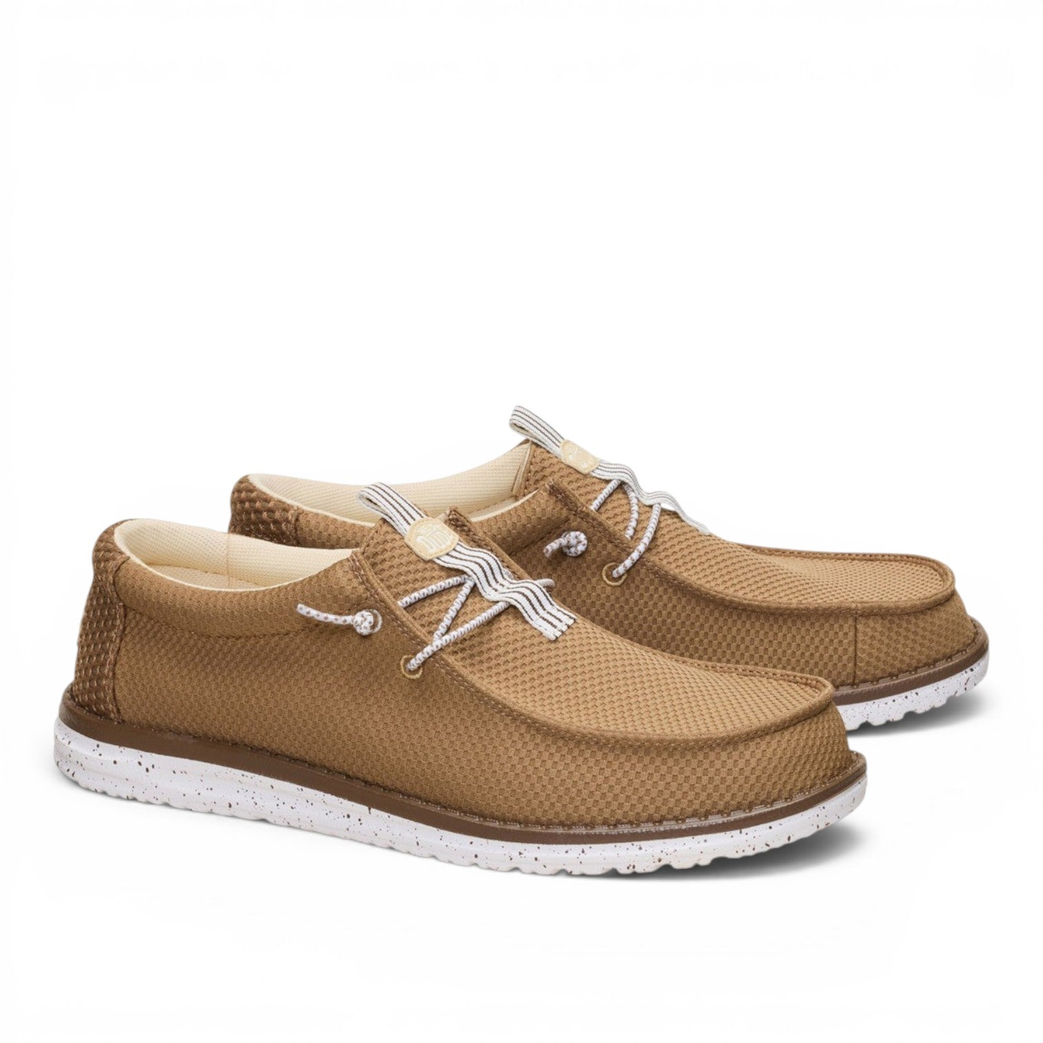 ShoeShop Hey Dude Wally mesh neutral tan slip-on shoes with white speckled soles and striped laces.