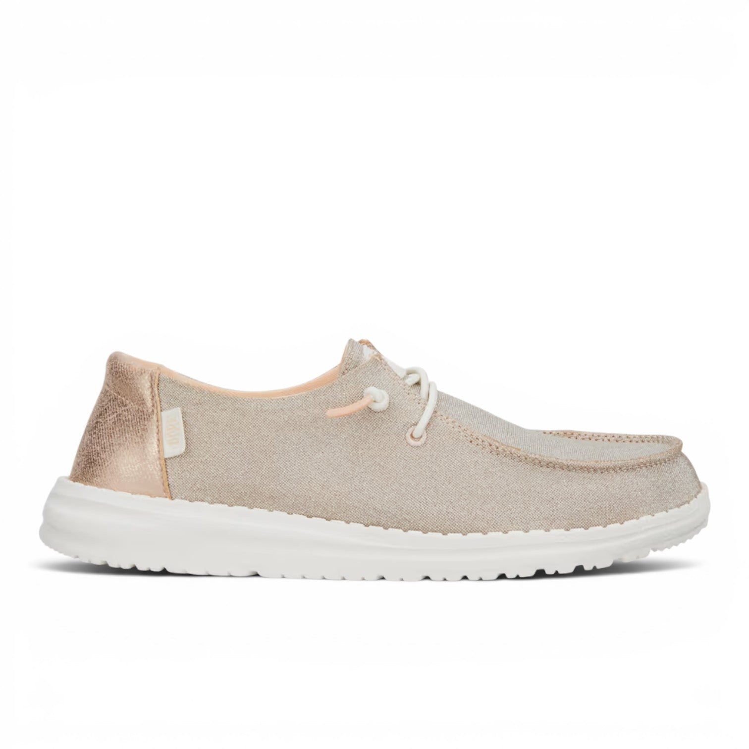 ShoeShop Hey Dude Wendy Metallic Sparkle slip-on shoes in rose gold with elastic laces and white flexible sole.