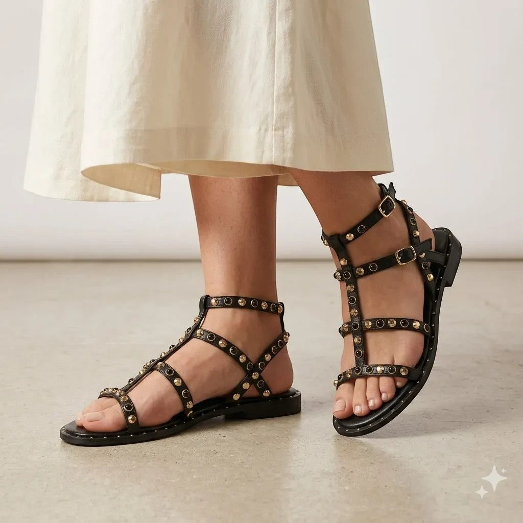 ShoeShop Kharisma black gladiator sandals featuring gold stud embellishments and adjustable buckle straps