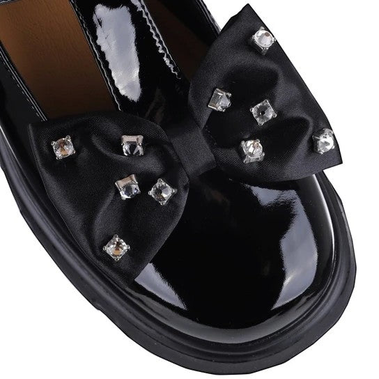 ShoeShop Loretta Vitale black patent leather loafer featuring a satin bow with sparkling crystal embellishments.