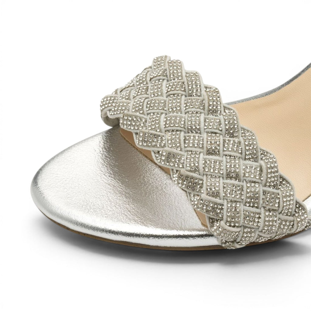 ShoeShop Marco Tozzi silver metallic sandal featuring a decorative woven strap embellished with sparkling rhinestones