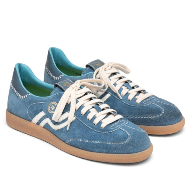 ShoeShop Primabase Polo light blue suede sneakers with white laces, gum rubber sole, and decorative stitching.