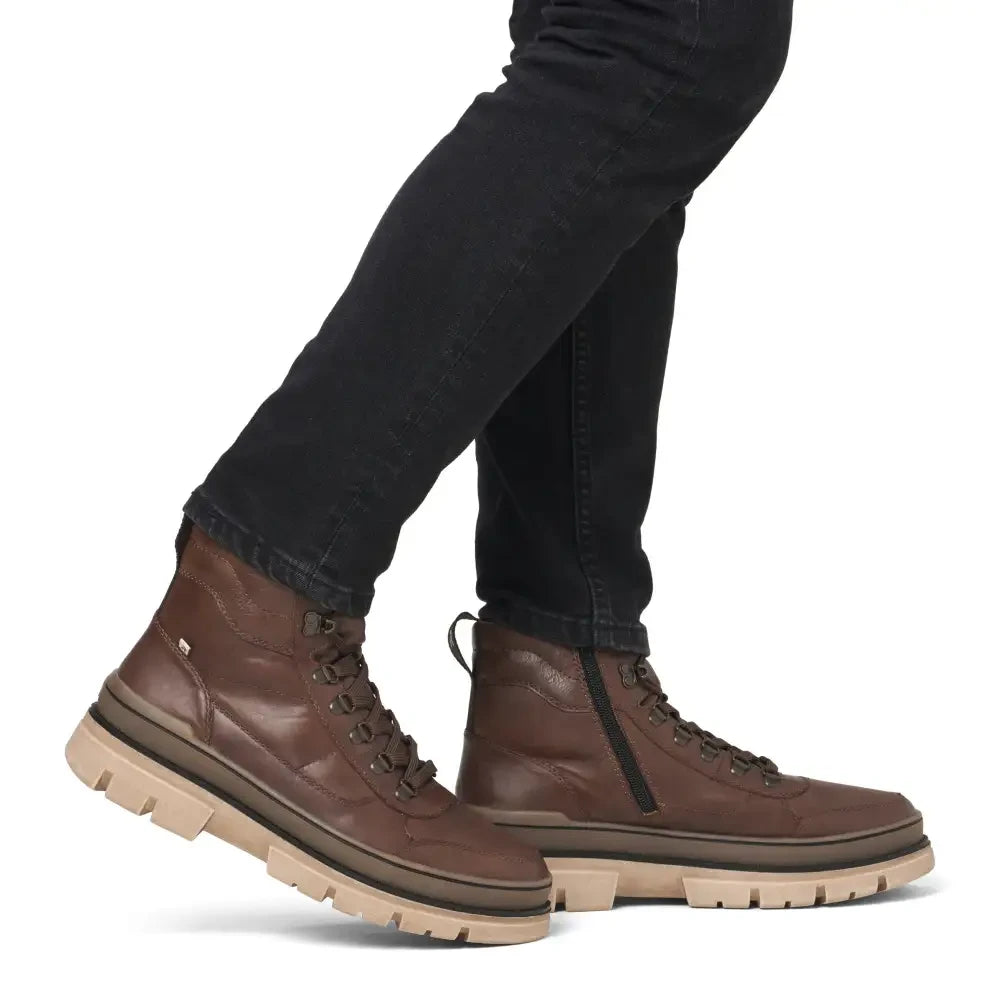 ShoeShop Rieker U1271-22 brown leather ankle boots with lace-up front, side zipper, and chunky beige lug sole