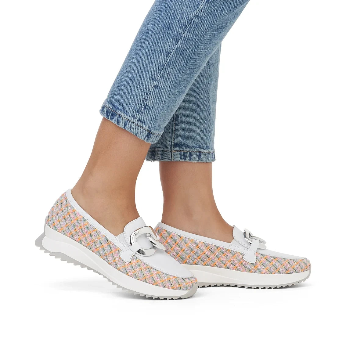 ShoeShop Rieker W1303-90 slip-on loafers featuring a multi-colored woven textile upper and white leather trim.