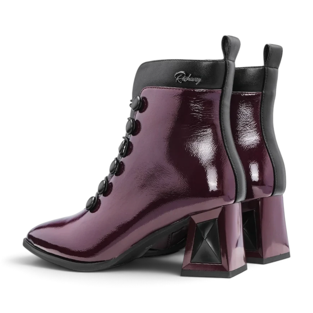 ShoeShop Rockaway ankle boots in glossy dark purple synthetic material with black button details and 6.5cm block heel