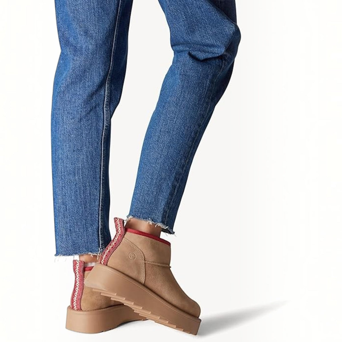 ShoeShop Tamaris beige suede ankle boots with red trim and thick platform soles worn with blue jeans