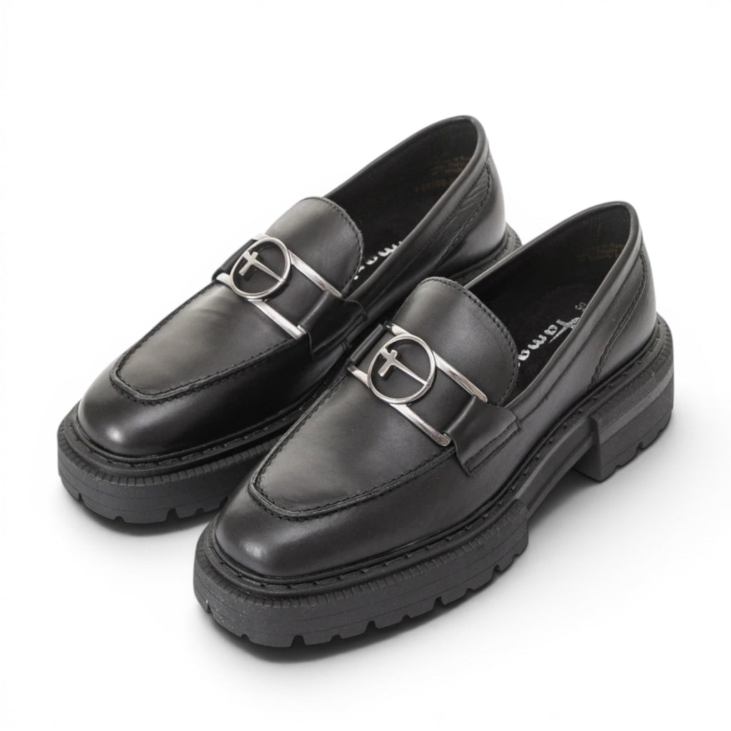 ShoeShop Tamaris black leather loafers with a silver metallic buckle detail and a chunky lug sole.