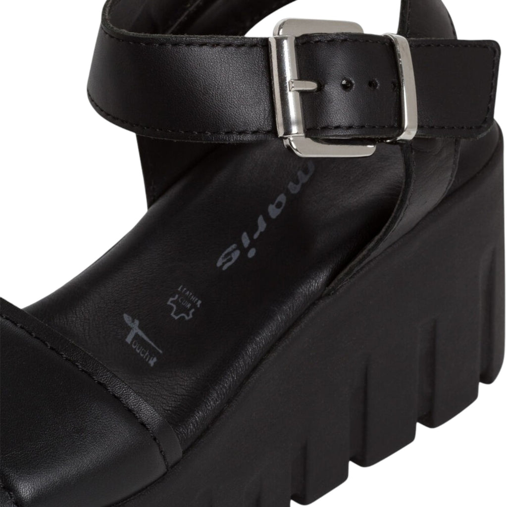 ShoeShop Tamaris black leather platform sandal with an adjustable ankle strap and chunky lug sole