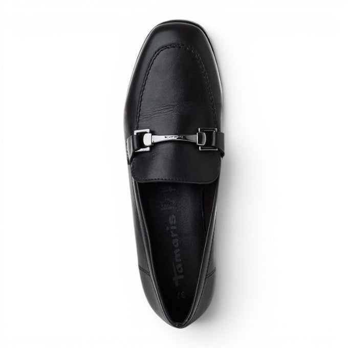 ShoeShop Tamaris black suede loafer with silver metal hardware detail, top-down view