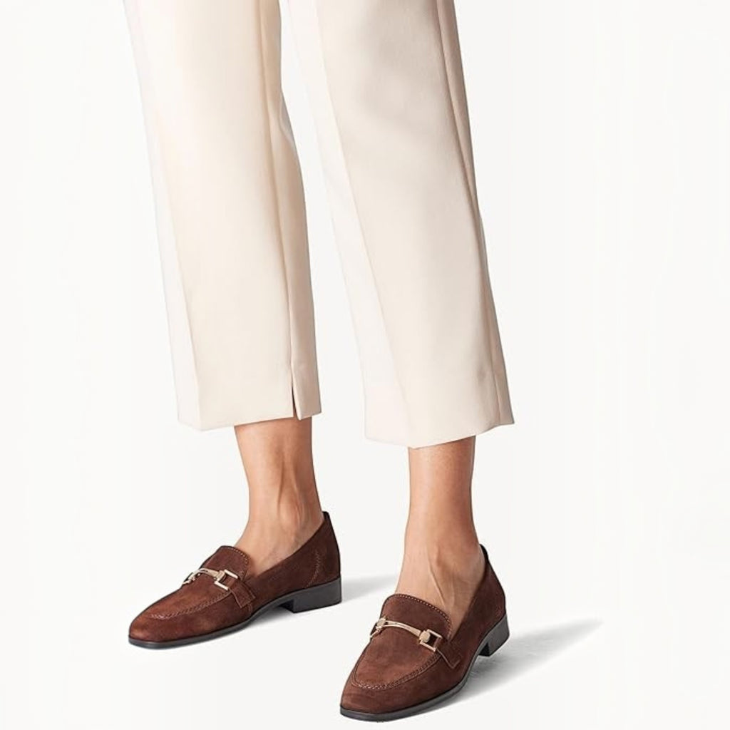 ShoeShop Tamaris brown suede loafers with gold-tone metal bit detail worn with cream trousers