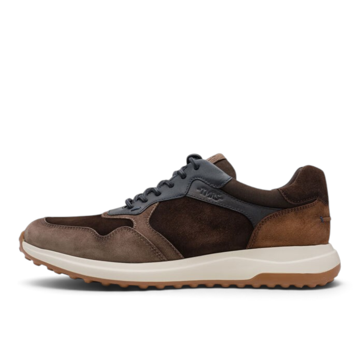 ShoeShop Tamaris brown suede and leather low-top sneaker with a white cushioned midsole and textured rubber sole