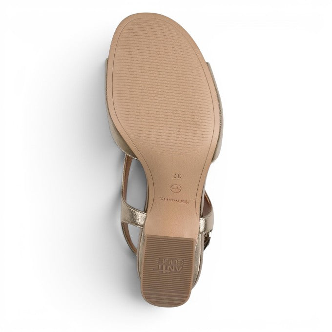ShoeShop Tamaris metallic gold heeled sandal showing the textured anti-slip sole and block heel from below