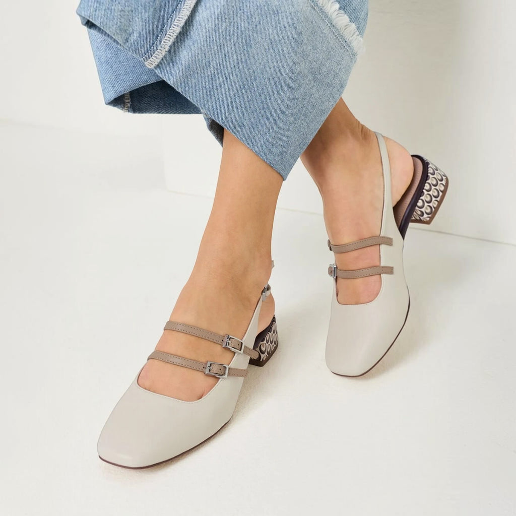 ShoeShop Tamaris light grey synthetic slingback heels with double buckle straps and decorative block heel.