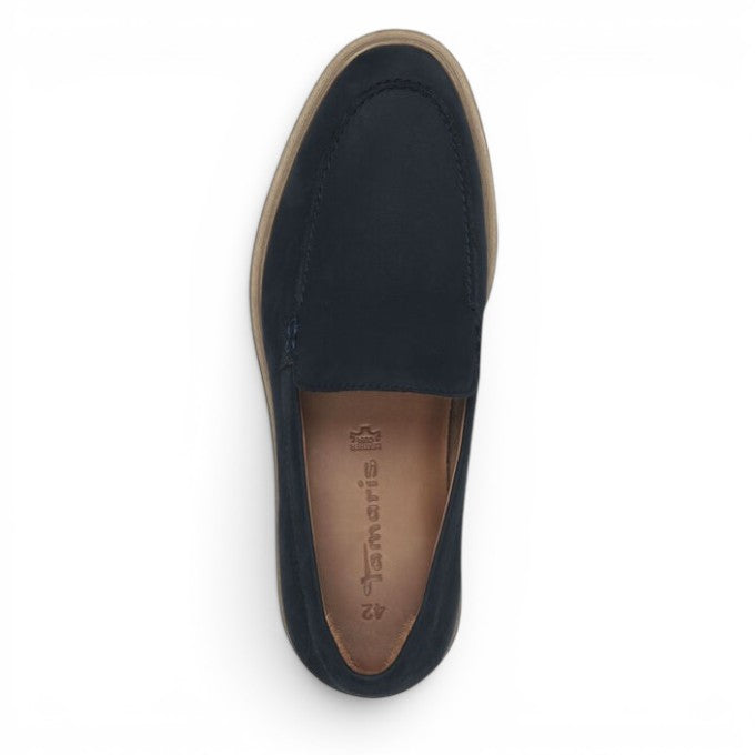 ShoeShop Tamaris navy blue slip-on loafer with a flat tan sole, top-down view
