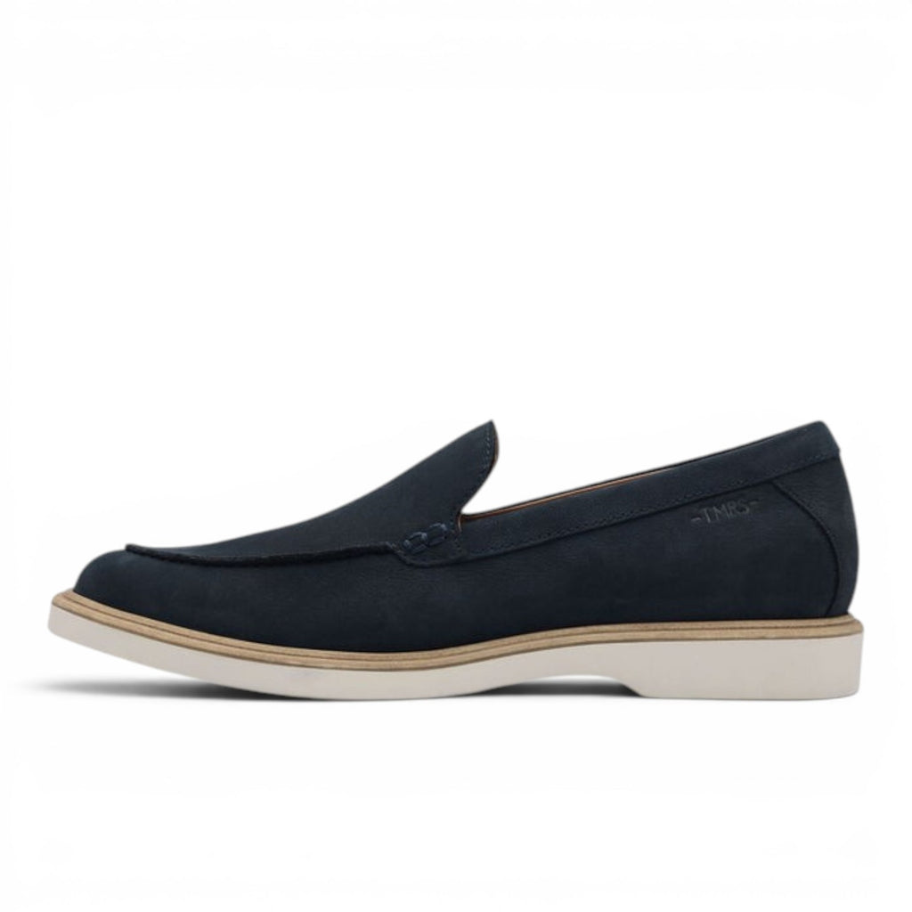 ShoeShop Tamaris navy blue suede slip-on loafers with a white flat sole