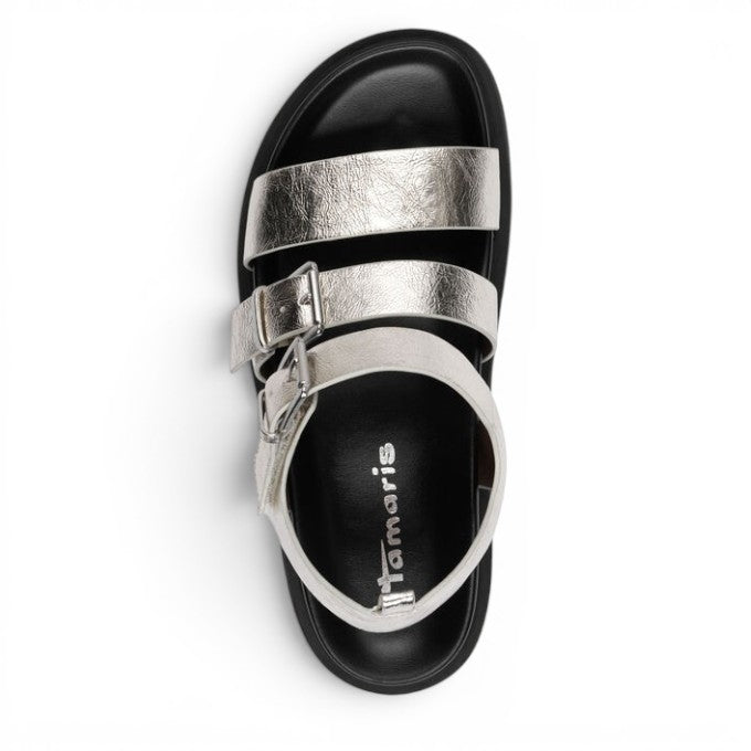 ShoeShop Tamaris metallic silver strappy sandals with buckle closure and black footbed, top view.