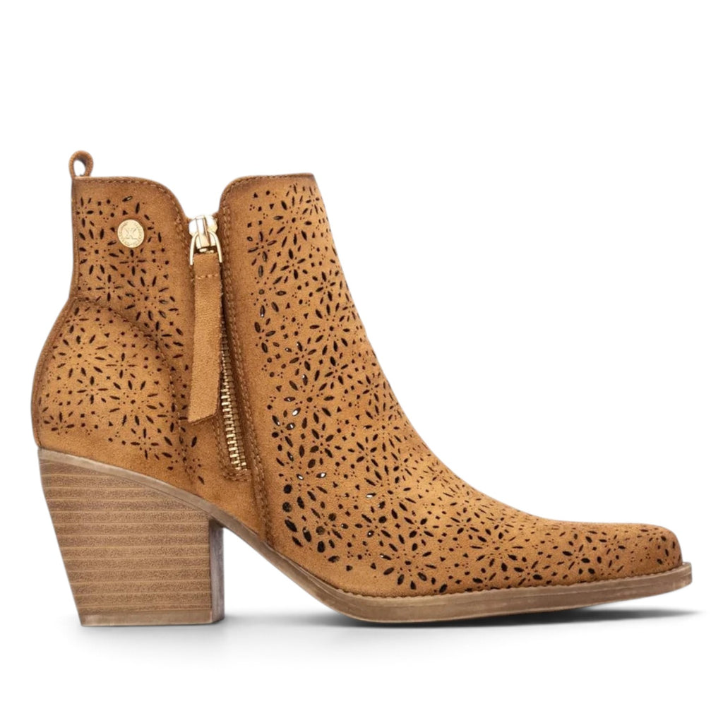 ShoeShop tan suede ankle boots with laser-cut floral patterns, side zipper, and a stacked block heel