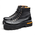 ShoeShop Uncle Paul Armand black leather boots with metal lace hooks, side zipper, and orange sole detail.