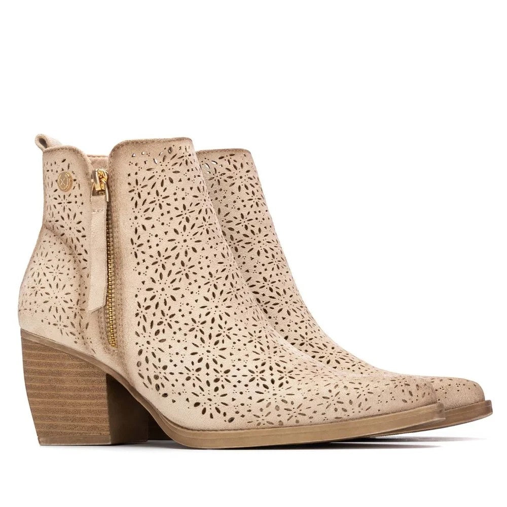 ShoeShop XTI beige ankle boots with laser-cut floral patterns, side zipper, and a stacked block heel