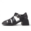 ShoeShop black leather caged sandal with buckle detail and block heel.