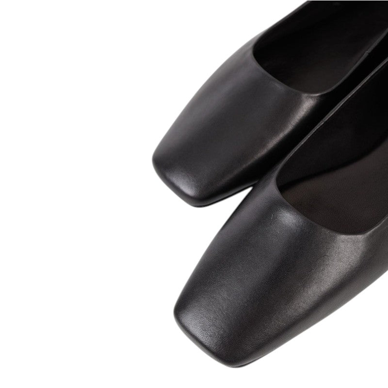 ShoeShop black leather square-toe Mary Jane flats with adjustable strap and low heel.