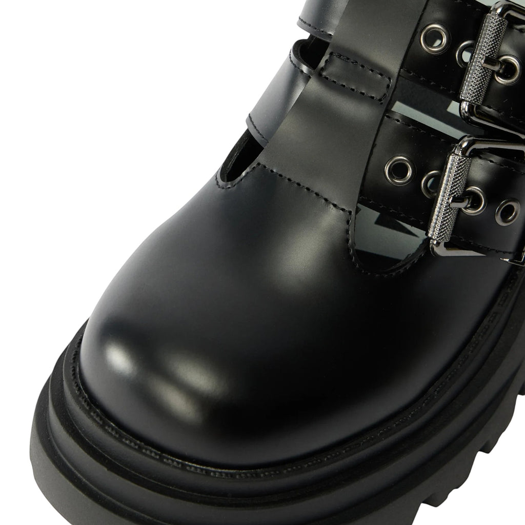 ShoeShop black faux leather platform shoes with double buckle straps and chunky sole.