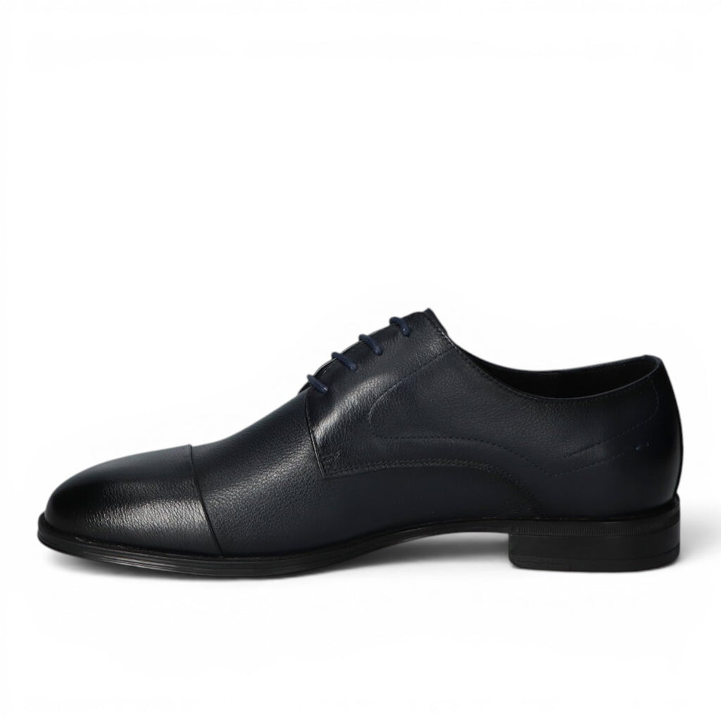 ShoeShop navy blue leather cap-toe oxford dress shoe with dark laces.