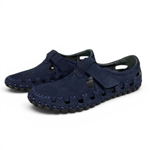 ShoeShop navy blue suede fisherman sandals with velcro straps and cut-out details.