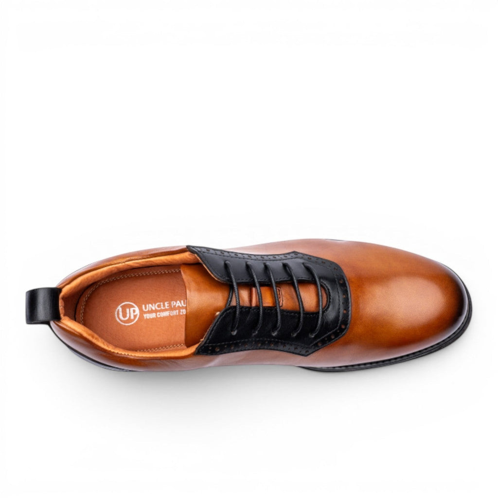 Uncle Paul Vaino men's tan leather derby shoes with black accents and laces. Features a two-tone design and rubber sole.